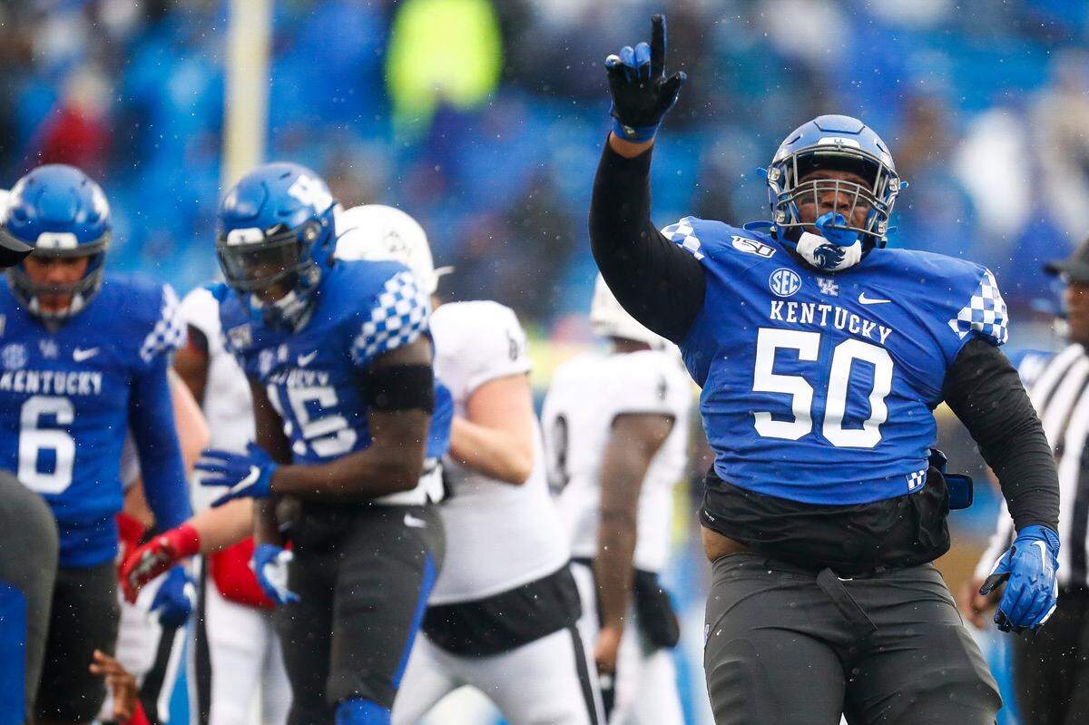 Kentucky defensive lineman Marquan McCall (50) celebrated during a game against Louisville at Kroger Field on Nov. 30, 2019.