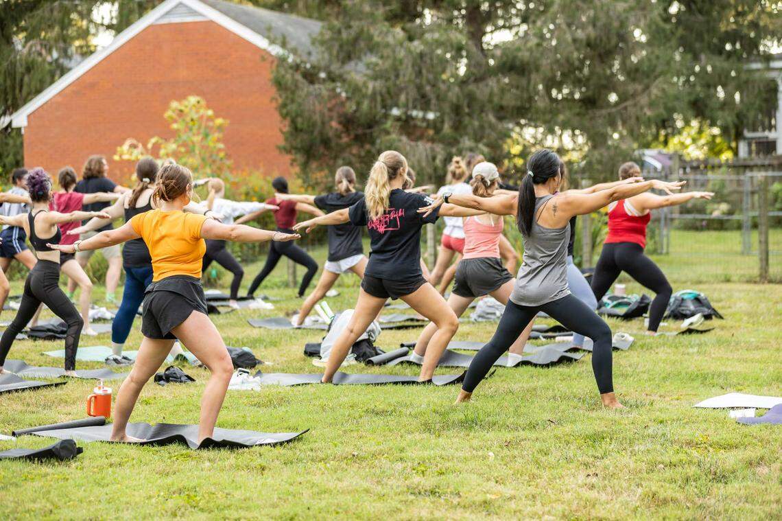 Centre students taking of a free outdoor yoga session hosted by the Office of Health Promotion shortly after classes began during the fall semester in September 2023.