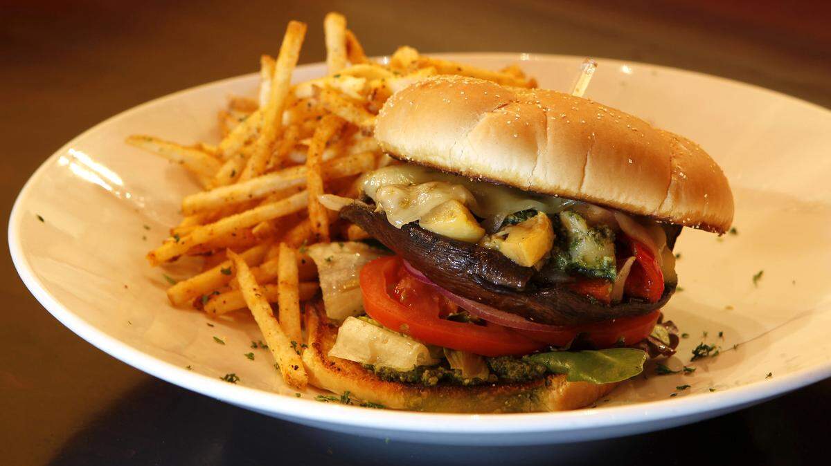 The portobello sandwich has a bit of pesto; the fries are thin and crisp.