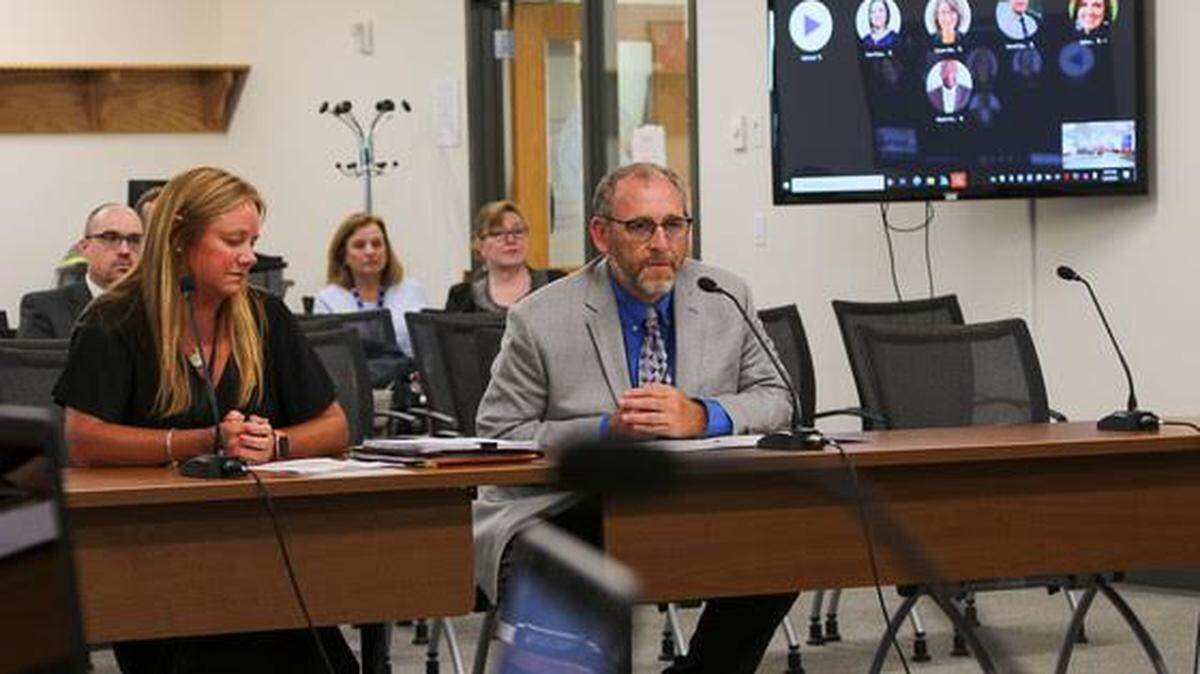 Kentucky Associate Commissioner Kelly Foster, left, and Menifee County Superintendent Tim Spencer spoke at the Kentucky Board of Education’s meeting on June 8, 2022. The board approved the release of Menifee County Schools from state assistance.