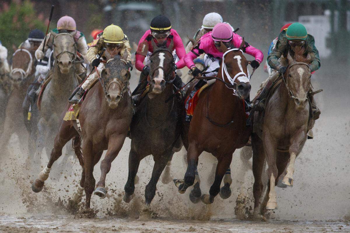 Country House, left, War of Will and Maximum Security bumped alongside Code of Honor as the field headed into the final stretch of the 145th Kentucky Derby. Maximum Security was disqualified.