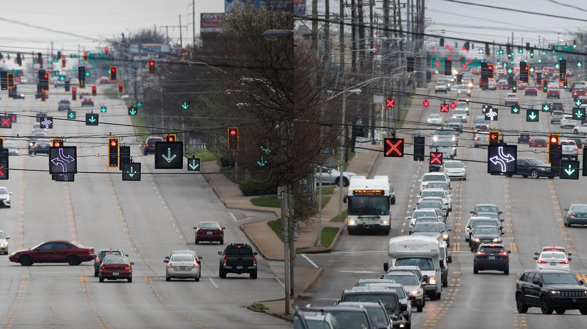 A composite image showing traffic along Nicholasville Road near Southland Drive in Lexington, Ky. Left, Motorists travel along Nicholasville Road near Southland Drive at 3:47 p.m. in Lexington, Ky., Saturday, March 28, 2020. Right, Motorists travel along Nicholasville Road near Southland Drive at 4:24 p.m. in Lexington, Ky., Wednesday, March 17, 2021.