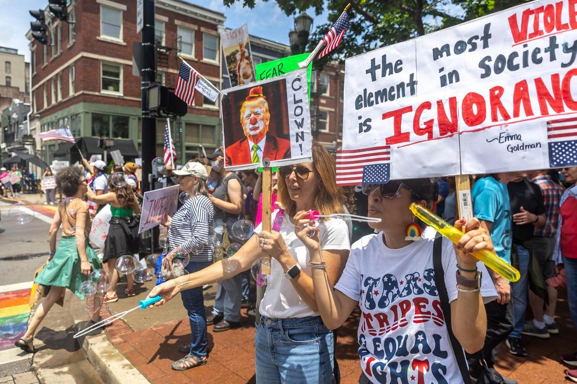 Tracie Dreyer-Hanes and Cecilia Castro blew bubbles during the “No Kings” protest on Saturday, June 14, 2025 in downtown Lexington.