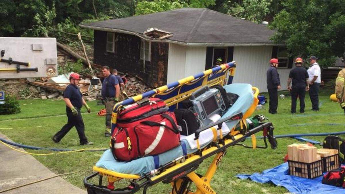 A Powell County woman was found alive after her home was hit by a mudslide.