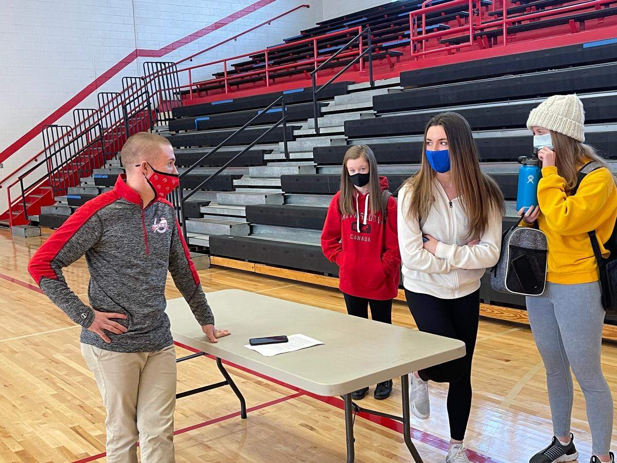 New West Jessamine Coach Ben Hall-Volpenhein spoke with a few players after his first team meeting Tuesday in the high school’s gym. This is Hall-Volpenhein’s first head coaching job.