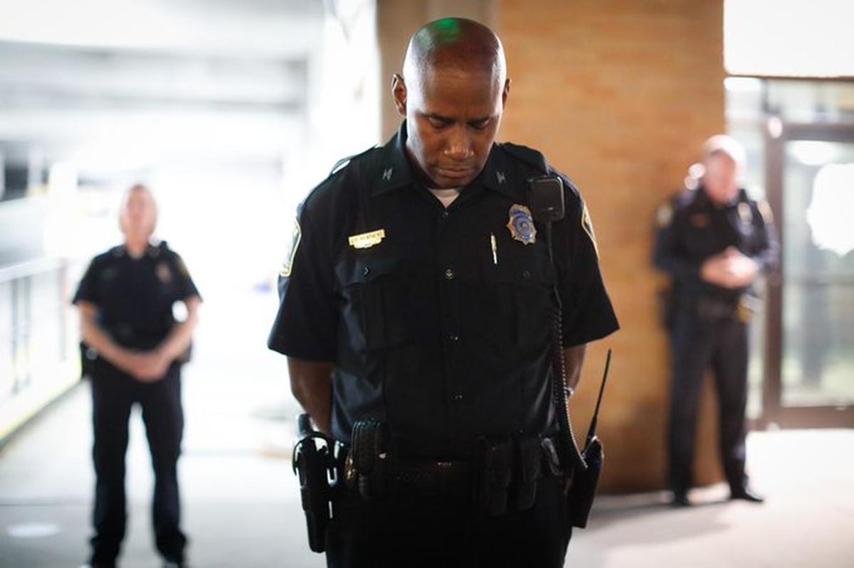 Lexington police Chief Lawrence Weathers bowed his head as protesters held eight minutes of silence, one for each time Breonna Taylor was shot.