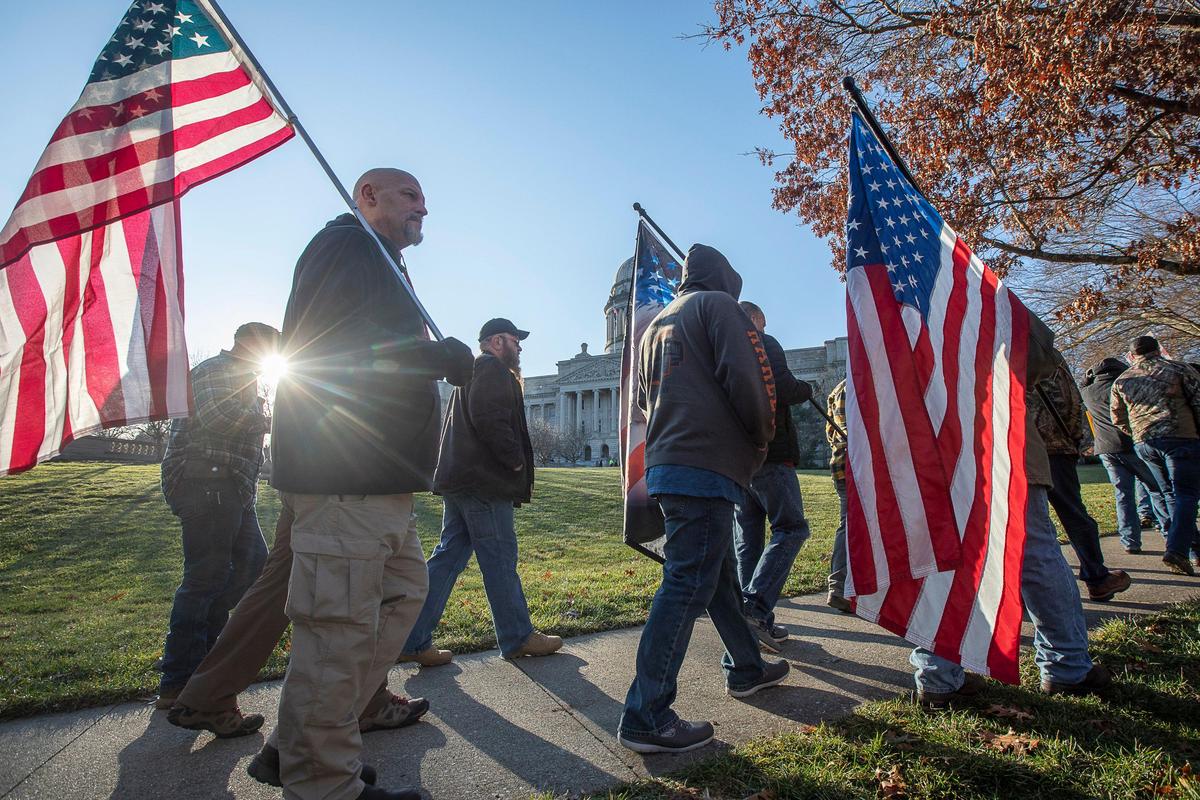 Participants of a rally in support of the Second Amendment walk near the State Capitol in Frankfort, Ky., Tuesday, Jan. 7, 2020.