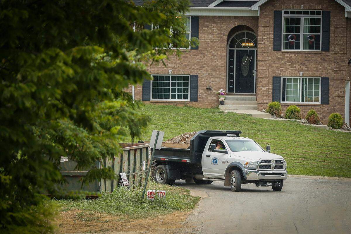 A truck carrying dirt and pieces of concrete was driven away from a property along North Howard Street as the FBI searched Wednesday for evidence in the disappearance of Crystal Rogers in Bardstown.