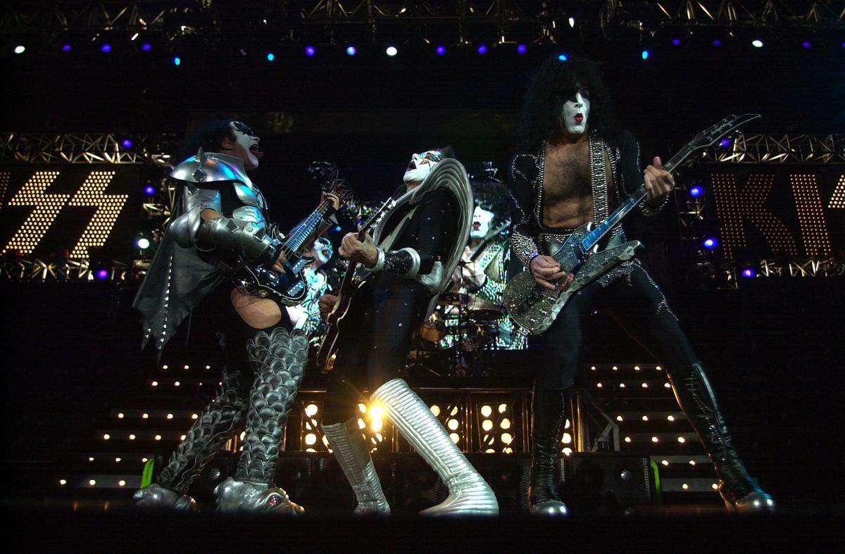 Kiss members Gene SImmons, left, Ace Frehley, center and Paul Stanley, jam during a Sept. 8, 2000 show at Rupp Arena, the groups last concert in Lexington.