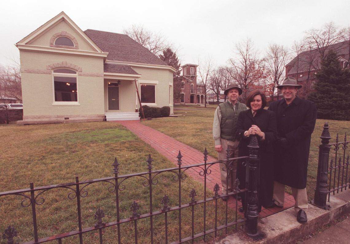 From left, John Martin Jr., Karen Wiley Hollins, and Gay Reading, standing outside the house that have bought on West Short Street in February 2000. They remodeled it and turned it into a tea room and antiques shop.