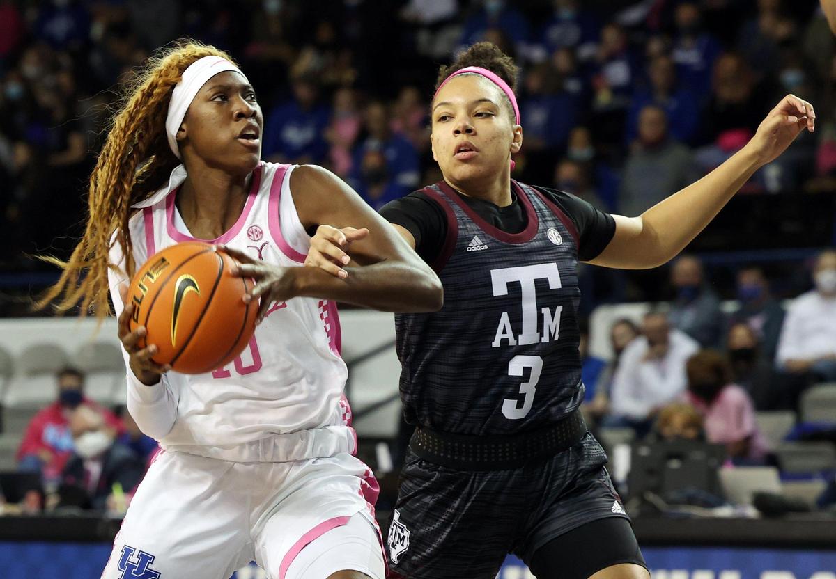Rhyne Howard, left, is pressured by Texas A&M’s Destiny Pitts (3) during their game in Memorial Coliseum on Feb. 6. Howard led the Wildcats with 19 points and 10 rebounds.