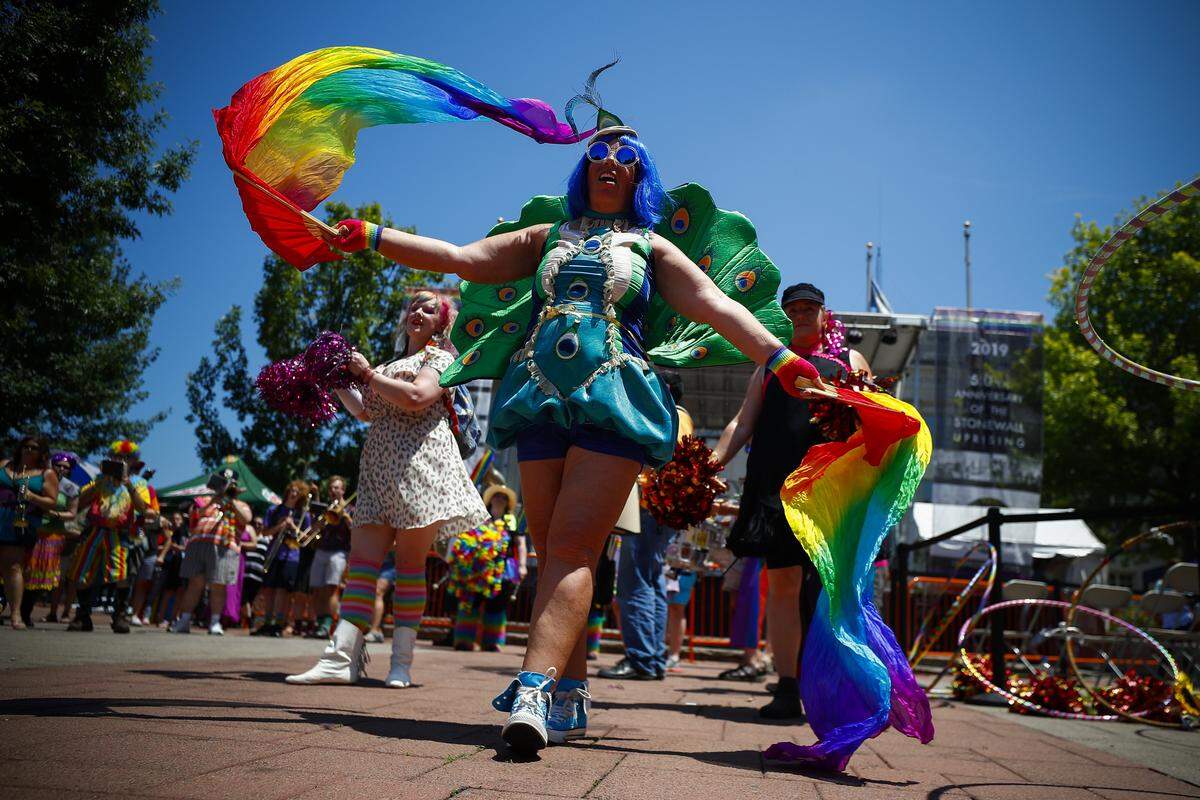 Lisa Borrelli Pettrey, of Lexington, a member of the March Madness Marching Band, performs for the crowd during the 2019 Lexington Pride Festival at Courthouse Plaza in downtown Lexington, Saturday, June 29, 2019.