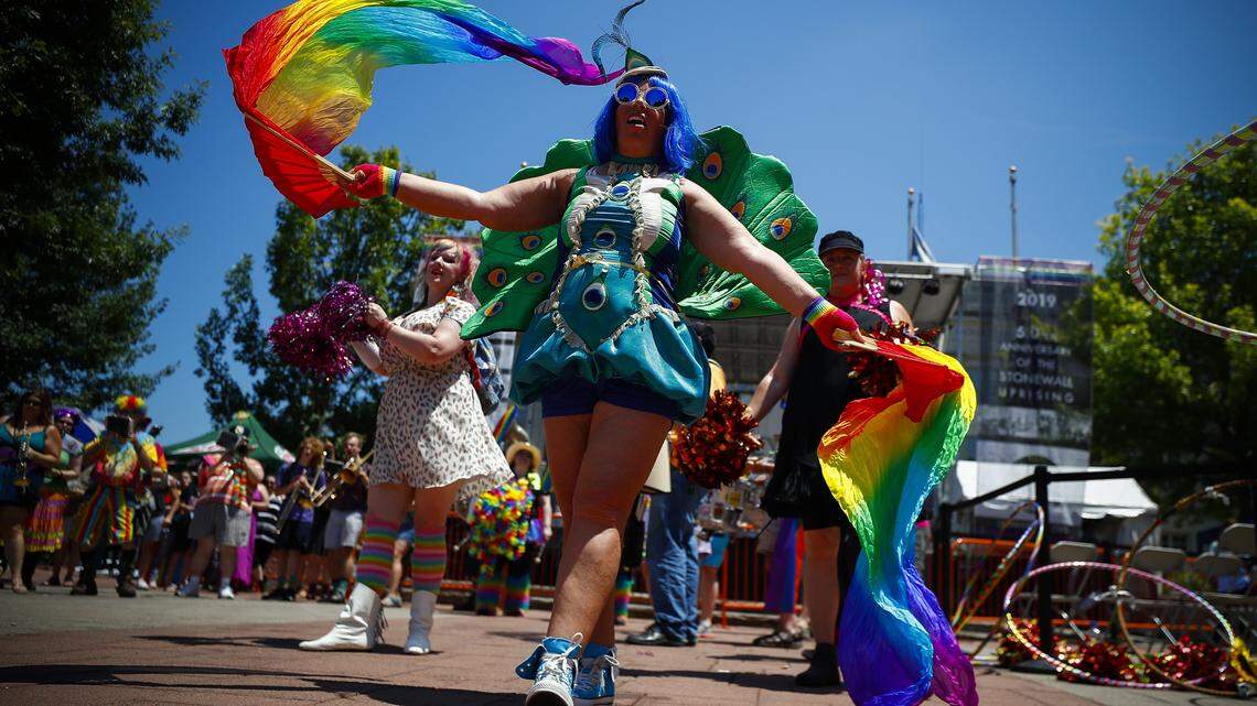 Lisa Borrelli Pettrey, of Lexington, a member of the March Madness Marching Band, performs for the crowd during the 2019 Lexington Pride Festival at Courthouse Plaza in downtown Lexington, Saturday, June 29, 2019.