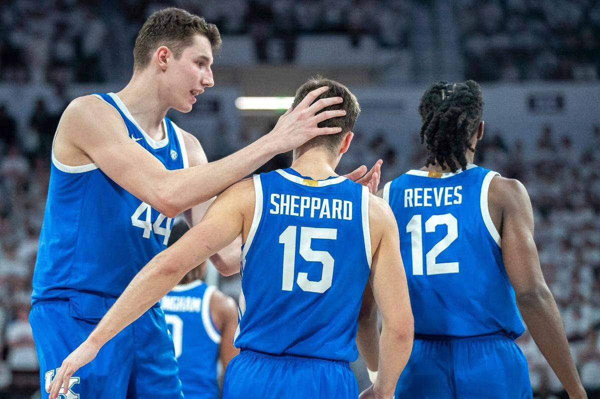 Kentucky’s Reed Sheppard is congratulated by teammate Zvonimir Ivisic during the Wildcats’ come-from-behind win at Mississippi State on Tuesday night.