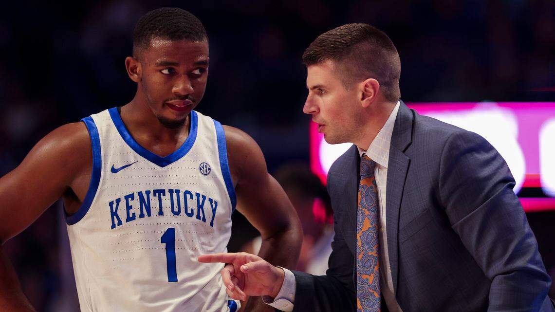 Kentucky guard Lamont Butler talks with assistant coach Cody Fueger during the game against Western Kentucky on Nov. 26. Butler scored a career-high 33 points in Saturday’s win over Louisville.