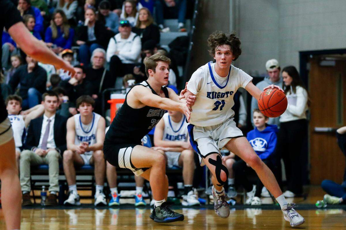 Lexington Catholic’s Hudson Sparks (31) drives to the basket against Lexington Christian during the 43rd District championship game at Lexington Catholic on Friday, Feb. 24, 2023.