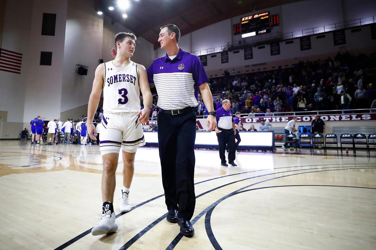 Somerset basketball coach Jeron Dunbar, right, said of Kade Grundy (3): “We always talk about how he’s living the storybook high-school career.”