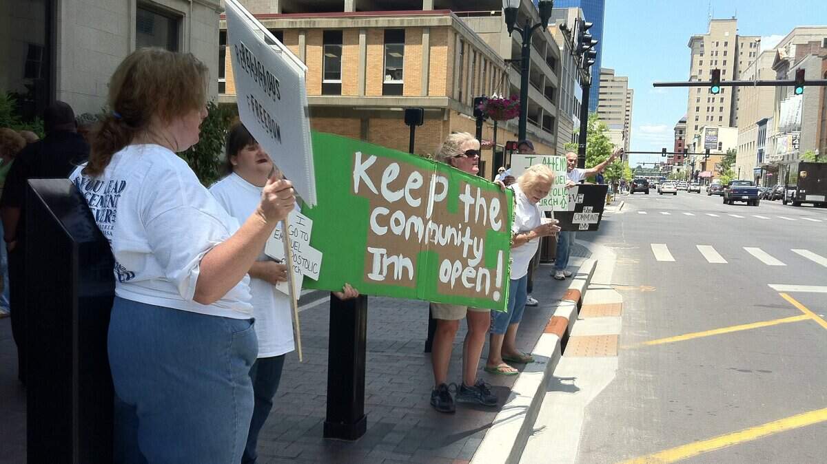 Outside City Hall, protesters showed support on Friday for the Community Inn on Winchester Road.