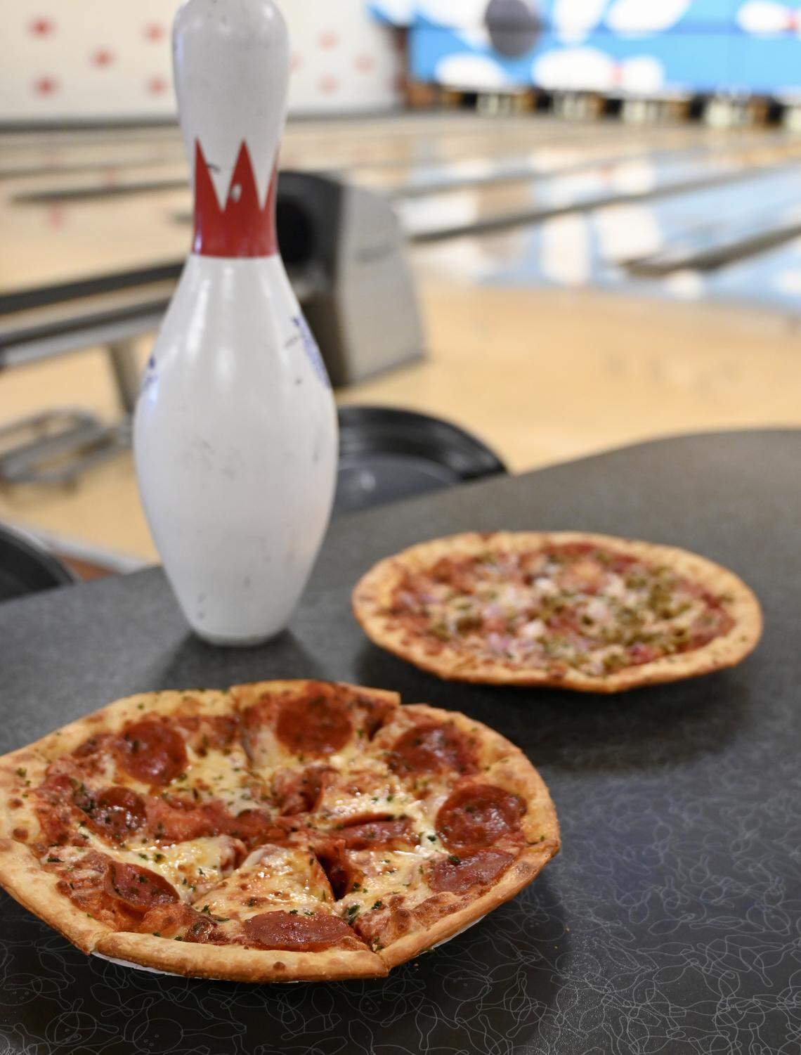 Southland Lanes has two options for Lexington Pizza Week, a meat option, The Gutterball Grinder, shown in front, and the vegetarian The Spare Supreme.