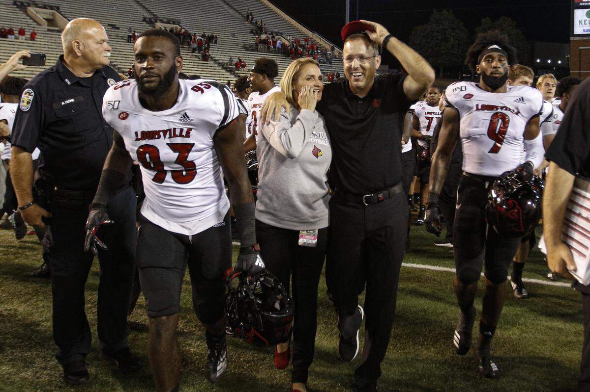 Louisville Coach Scott Satterfield and his wife, Beth, celebrated after U of L defeated Wake Forest 62-59 earlier this season.