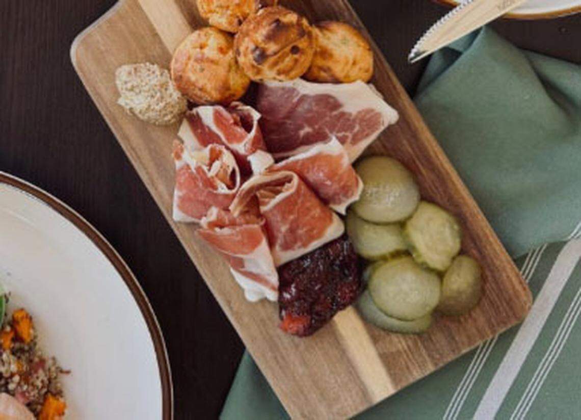The Kentucky board ($18) featuring ham, bourbon mustard, house-made jam, fridge pickles and pimento corn muffins from Millstone.