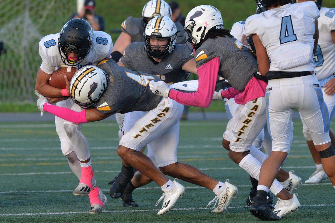 Woodford County’s highly rated defense was able to contain Collins star quarterback Kenyon Goodin (8) for most of the night during the Yellow Jackets’ 64-21 victory in Versailles on Friday.