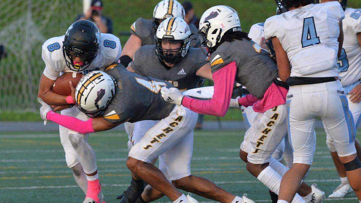 Woodford County’s defense was able to contain Collins star quarterback Kenyon Goodin (8) for most of the night during the Yellow Jackets’ 64-21 victory in Versailles on Oct. 15, 2021.