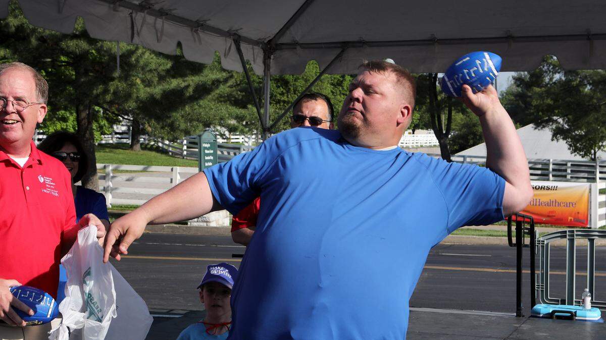 Jared Lorenzen threw a souvenir football Saturday prior to the Central Kentucky Heart Walk at Keeneland Saturday.