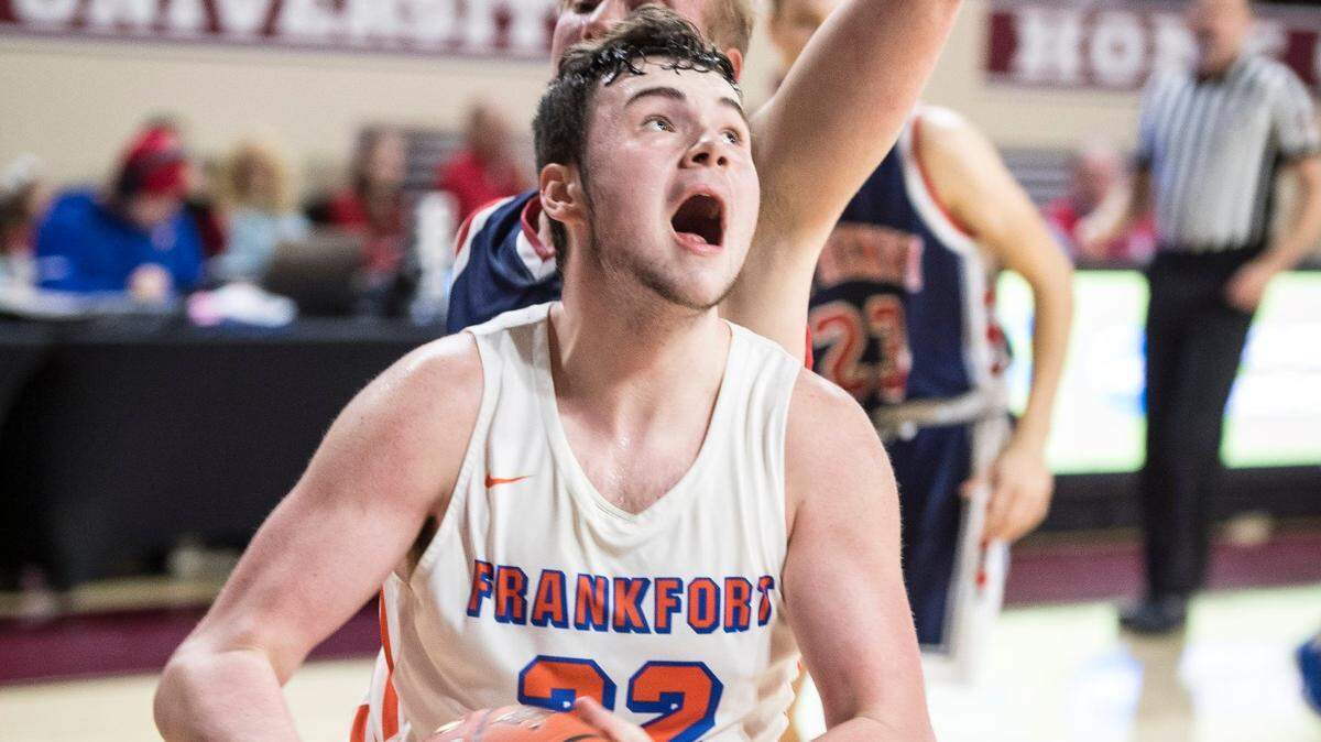 Frankfort’s Jackson Twombly drives the lane against St. Henry’s Luke Maher, during the finals of the boys All-A Classic, Sunday, January 26, 2020, at EKU’s McBrayer Arena in Richmond.