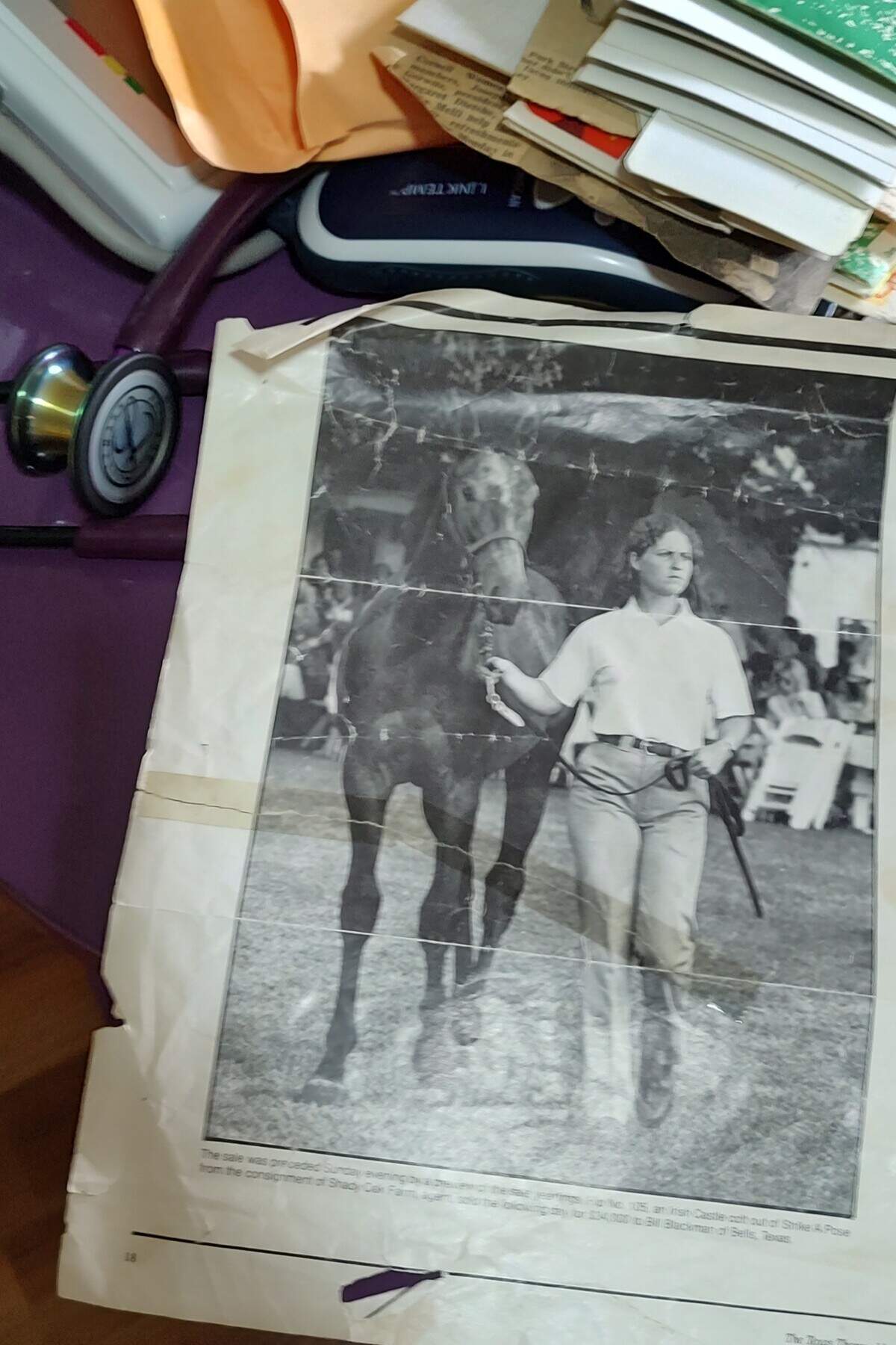 Dr. Rebecca Bosomworth was shown handling a horse at a horse sale in this photo that lay alongside a stethoscope in her home office in Lexington, KY.