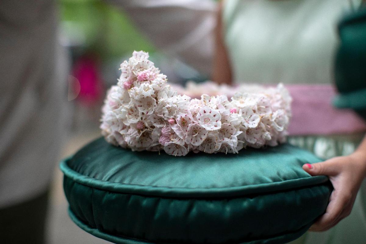 A crown made of mountain-laurel flowers is placed on a pillow right before Gov. Andy Beshear crowns the new queen Saturday. The flowers for the crown are picked the morning of the coronation.