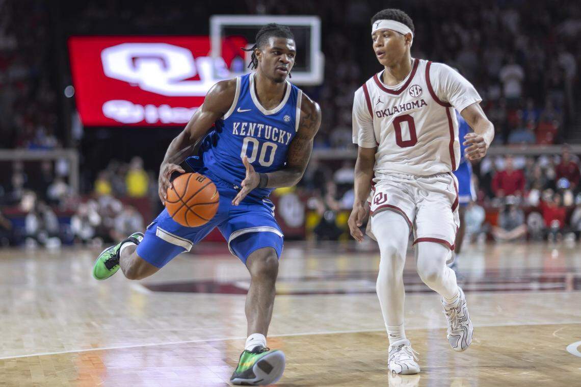 Kentucky guard Otega Oweh (00) drives the ball as Oklahoma guard Jeremiah Fears (0) defends during Wednesday’s game at Lloyd Noble Center in Norman, Okla.