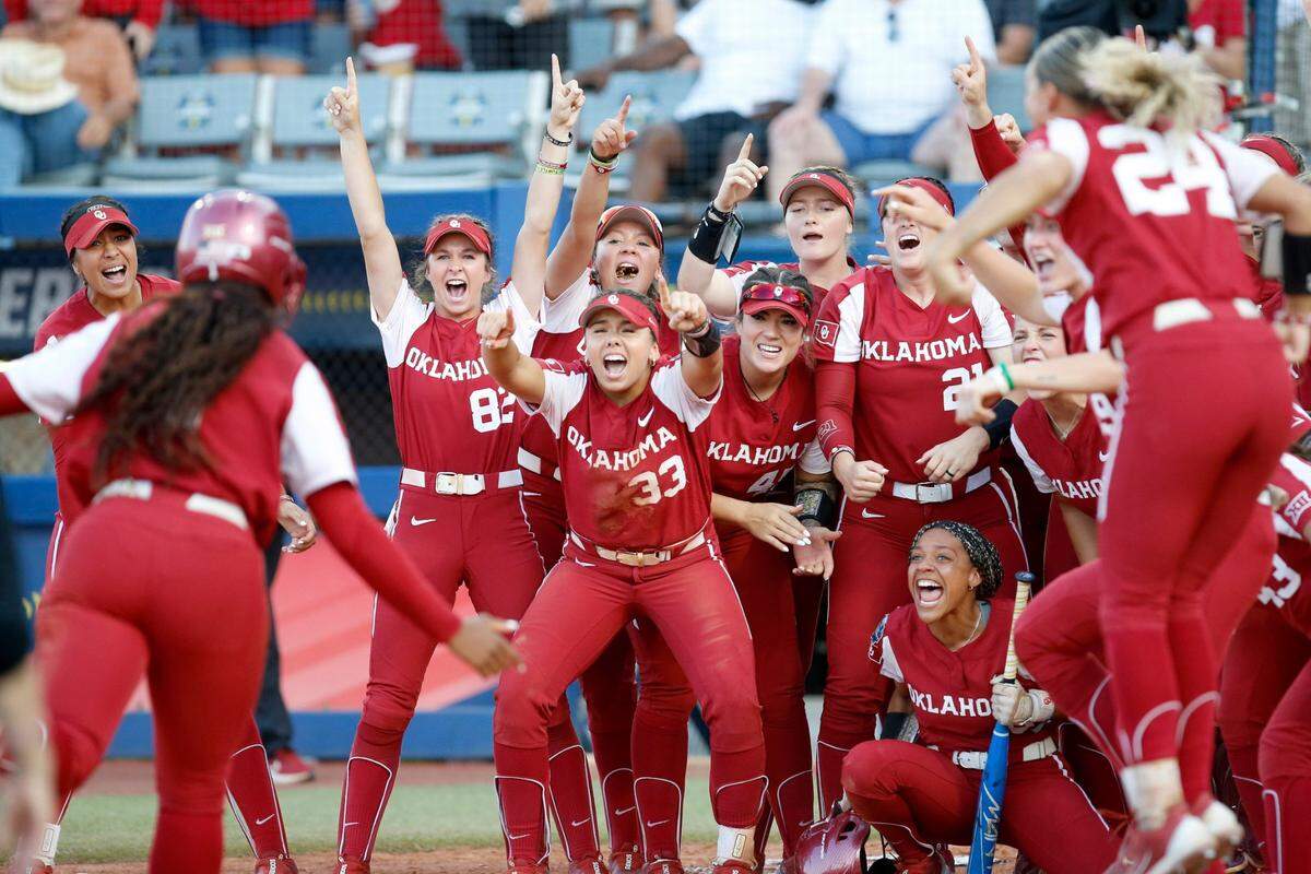 Oklahoma celebrates the home run of Cydney Sanders (1) in the fifth inning during the second game of the Women's College World Championship Series between the Oklahoma Sooners and Florida State at USA Softball Hall of Fame Stadium in Oklahoma City, Thursday, June, 8, 2023.