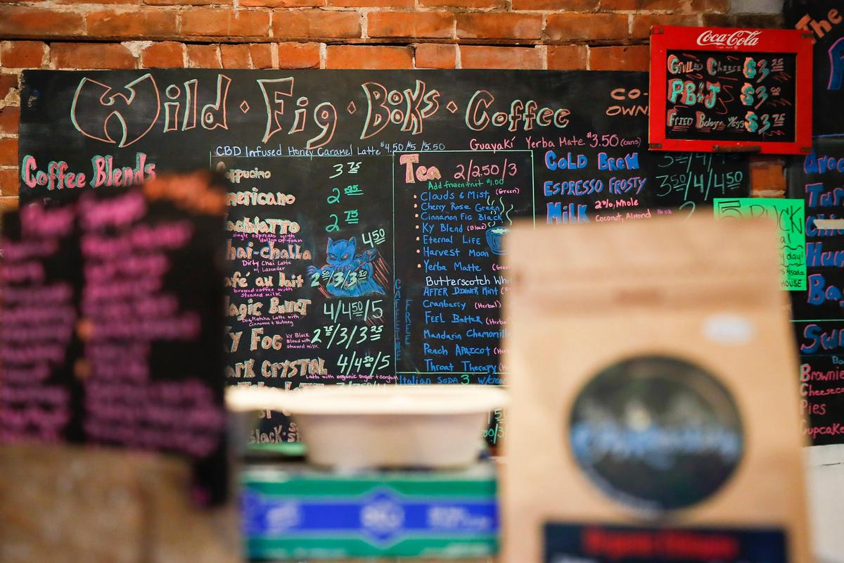 The menu at Wild Fig Books & Coffee in Lexington, Wednesday, July 31, 2019. Wild Fig Books & Coffee is attempting to draw in more business by offering programs such as comedy shows and film screenings.