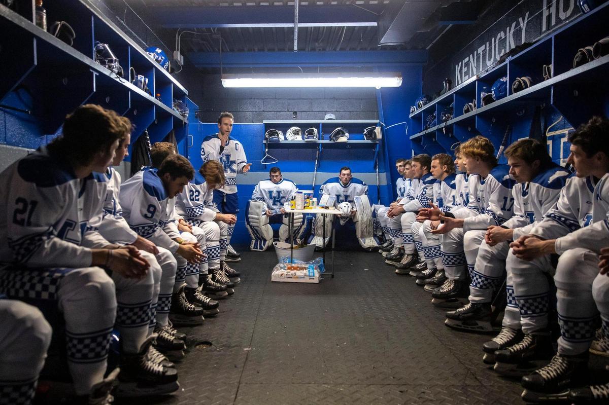 University of Kentucky captain Gary Eastlack (13), standing center left, addresses the team prior to its January game against Louisville, which started a little after midnight.