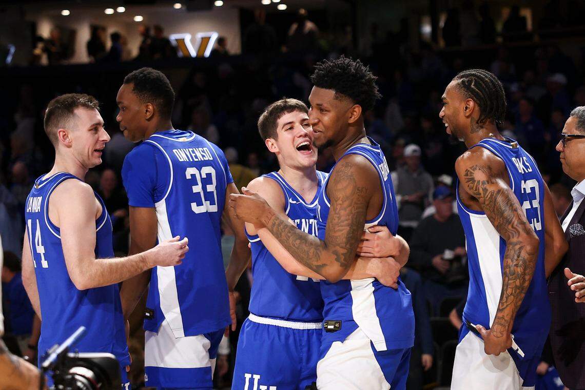 Kentucky’s Reed Sheppard (15) hugs teammate Justin Edwards as the team celebrates its defeat of Vanderbilt on Tuesday night at Memorial Gymnasium in Nashville, Tennessee.