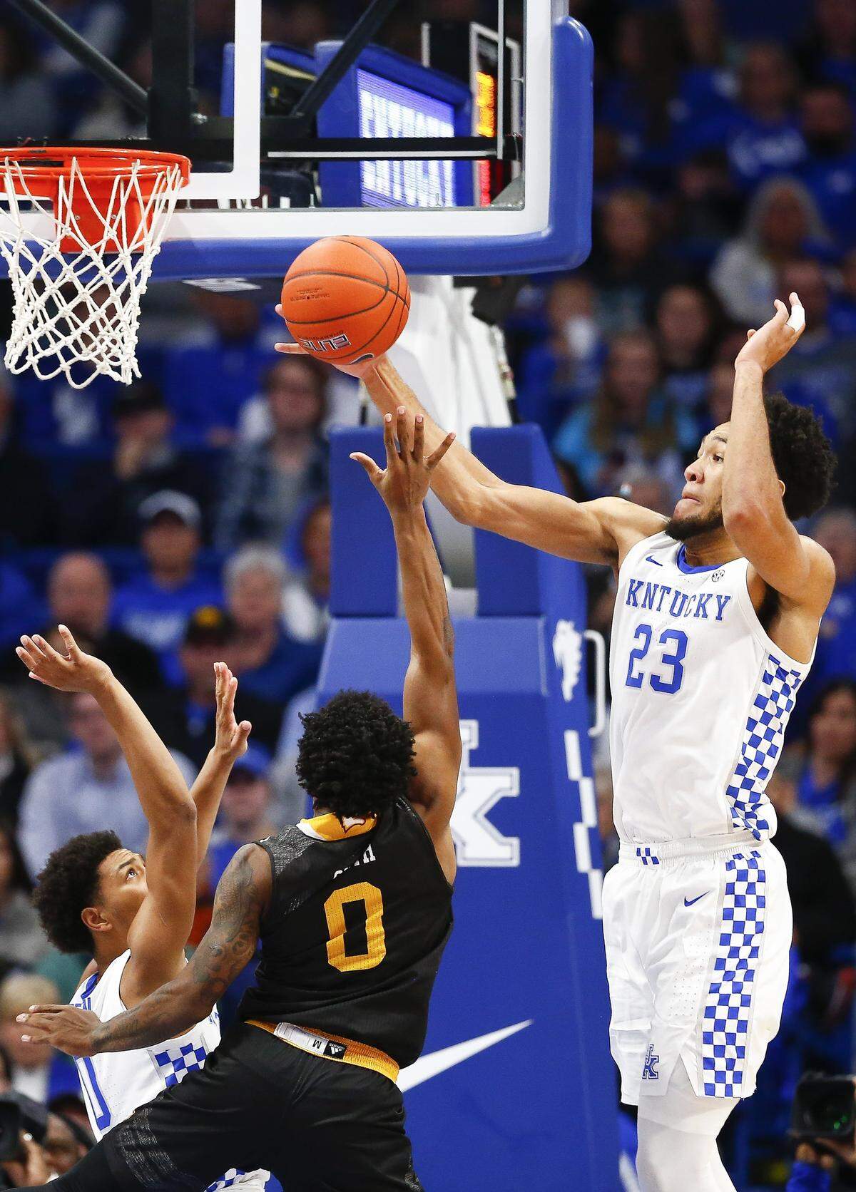 Kentucky’s EJ Montgomery (23) blocked a shot by Winthrop’s Nych Smith last week in Rupp Arena. The freshman leads the Wildcats with 11 blocks this season.