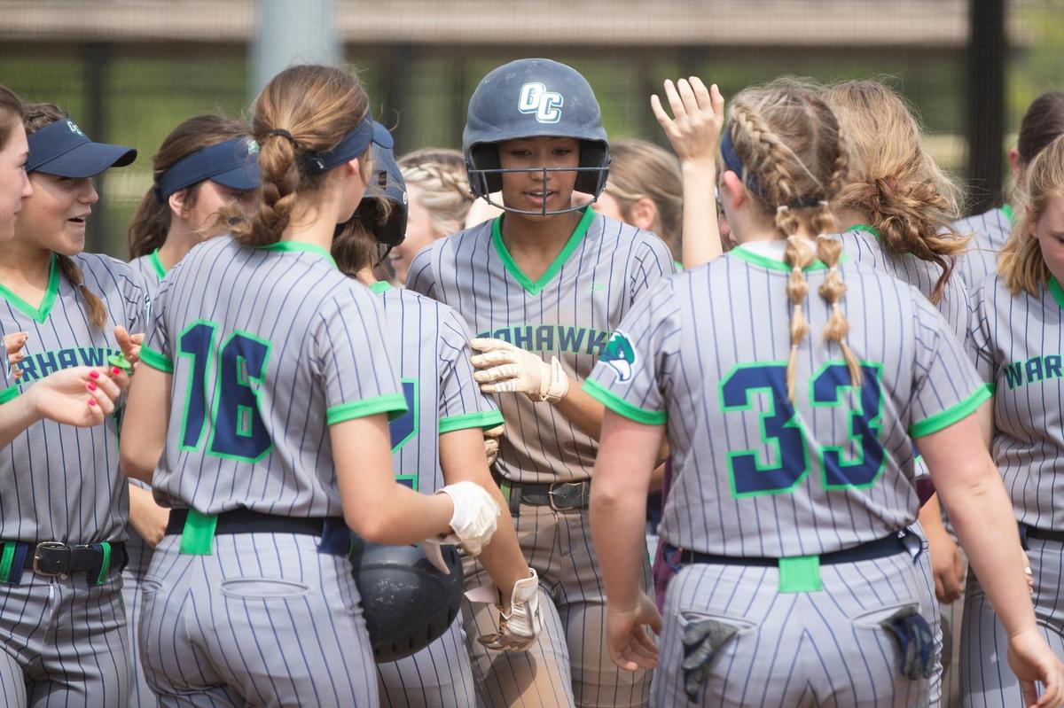 Great Crossing’s Delani Sullivan, center, celebrates with her team after hitting a home run against Henderson County on April 30.