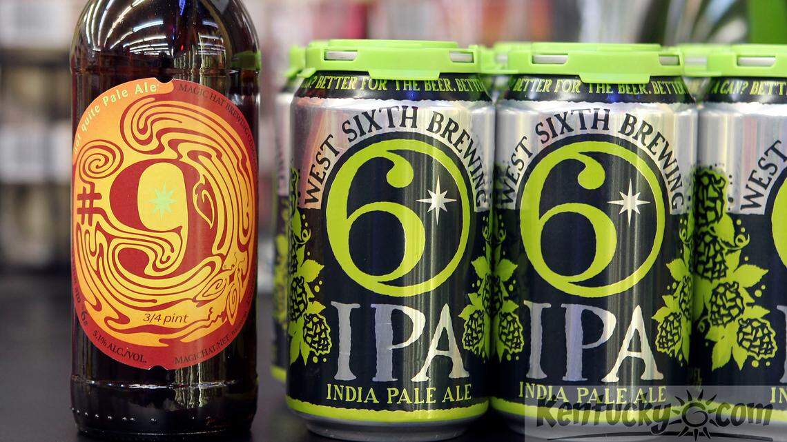  A bottle of Magic Hat #9 Not Quite Pale Ale, left, and cans of West Sixth Brewing IPA, right, photographed in Lexington, Ky., Tuesday, May 21, 2013. Magic Hat Brewery is suiting West Sixth Brewing Company for copyright infringement for West Sixth's logo. Magic Hat has a similar looking logo on their #9 Not Quite Pale Ale. Photo by Charles Bertram | Staff