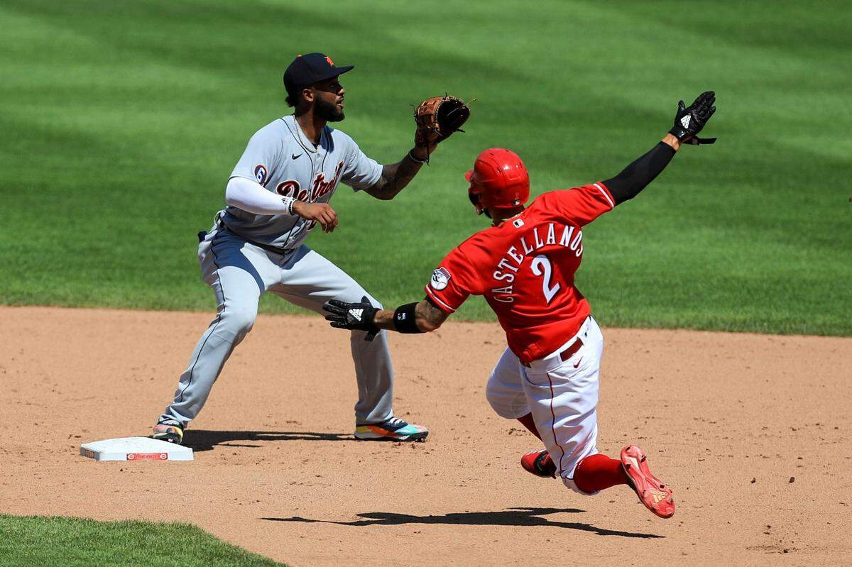 The Reds’ Nick Castellanos was forced out at second base by the Tigers’ Niko Goodrum during Sunday’s game.