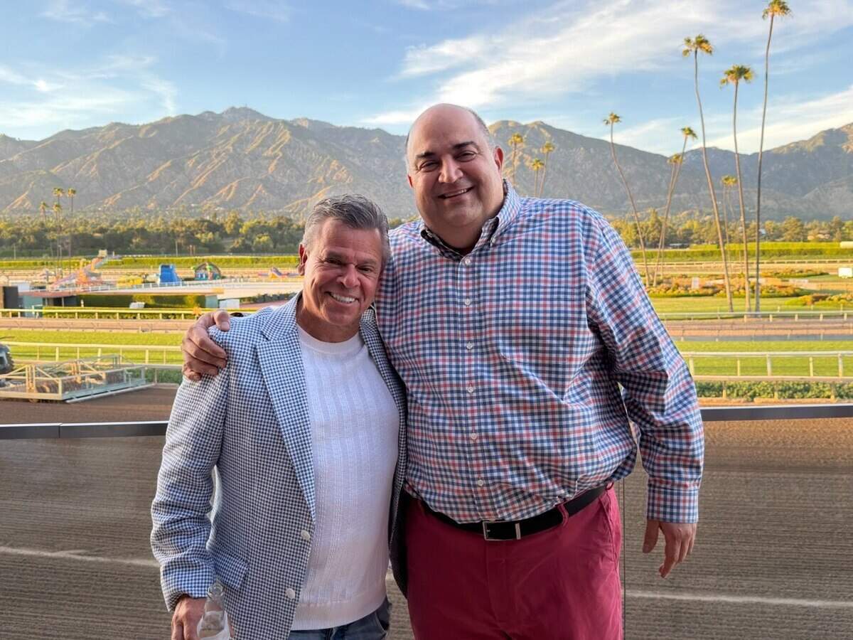Anthony Valinoti with Frank Mirahmadi at the Santa Anita racetrack, where Mirahmadi is the track announcer.