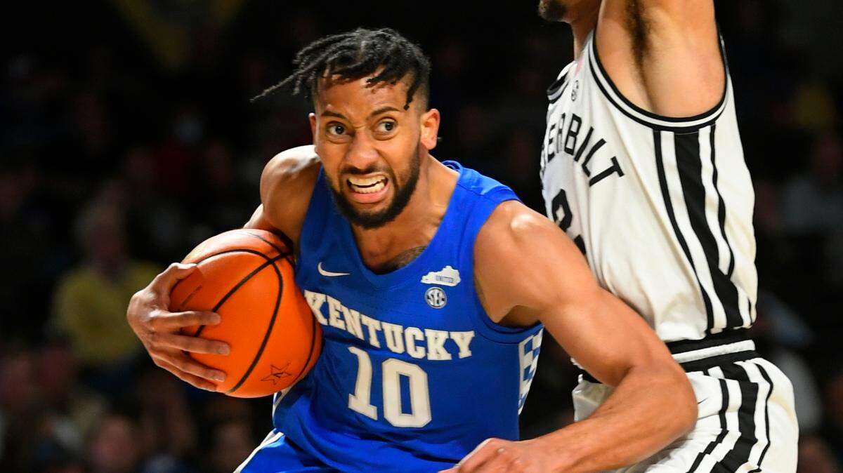 Kentucky guard Davion Mintz (10) tries to get around the defense of Vanderbilt guard Scotty Pippen Jr. during the first half. Mintz finished with nine points.
