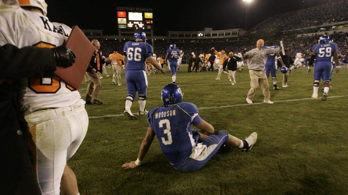 After the 2007 season-ending game, Kentucky quarterback Andre Woodson could only sit on the field at Commonwealth  Stadium as Tennessee celebrated its 52-50 win in four overtimes. 