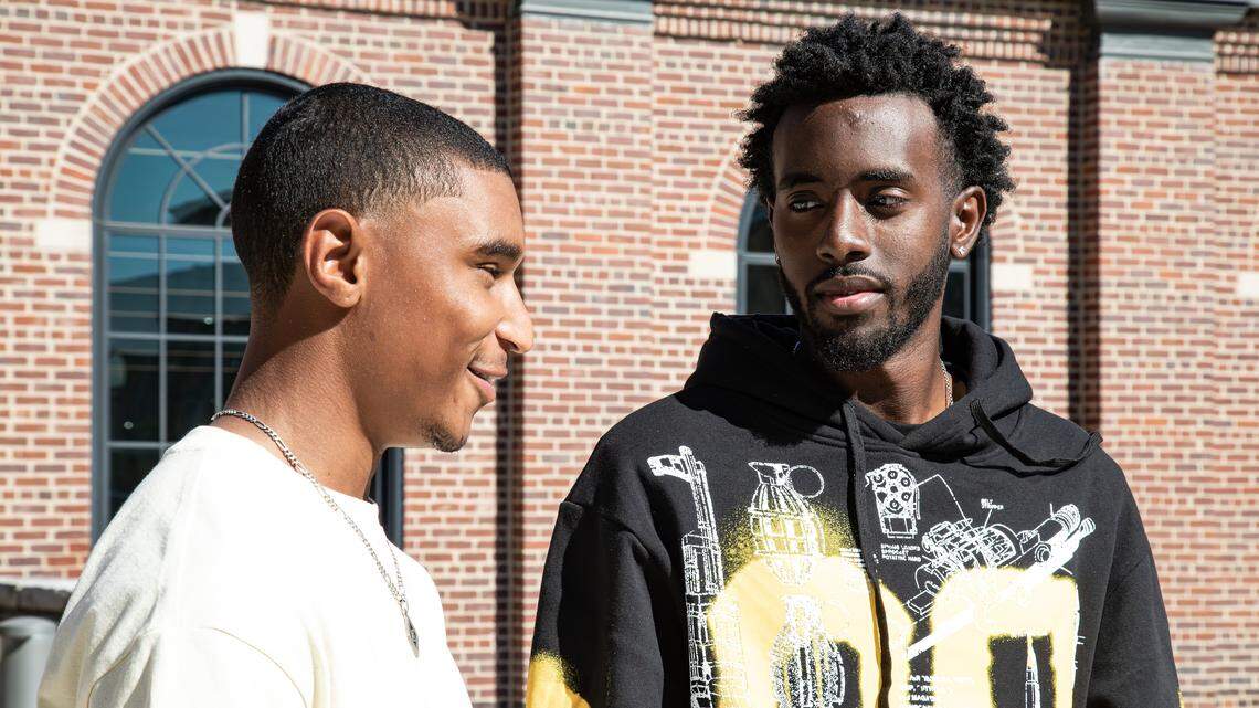 (From right to left) Cyril Tchouta-Moussa, Austin Anderson speak on campus Greek life at Gatton Student Center during UK's first day of the fall semester on August 25, 2025, in Lexington, Ky.