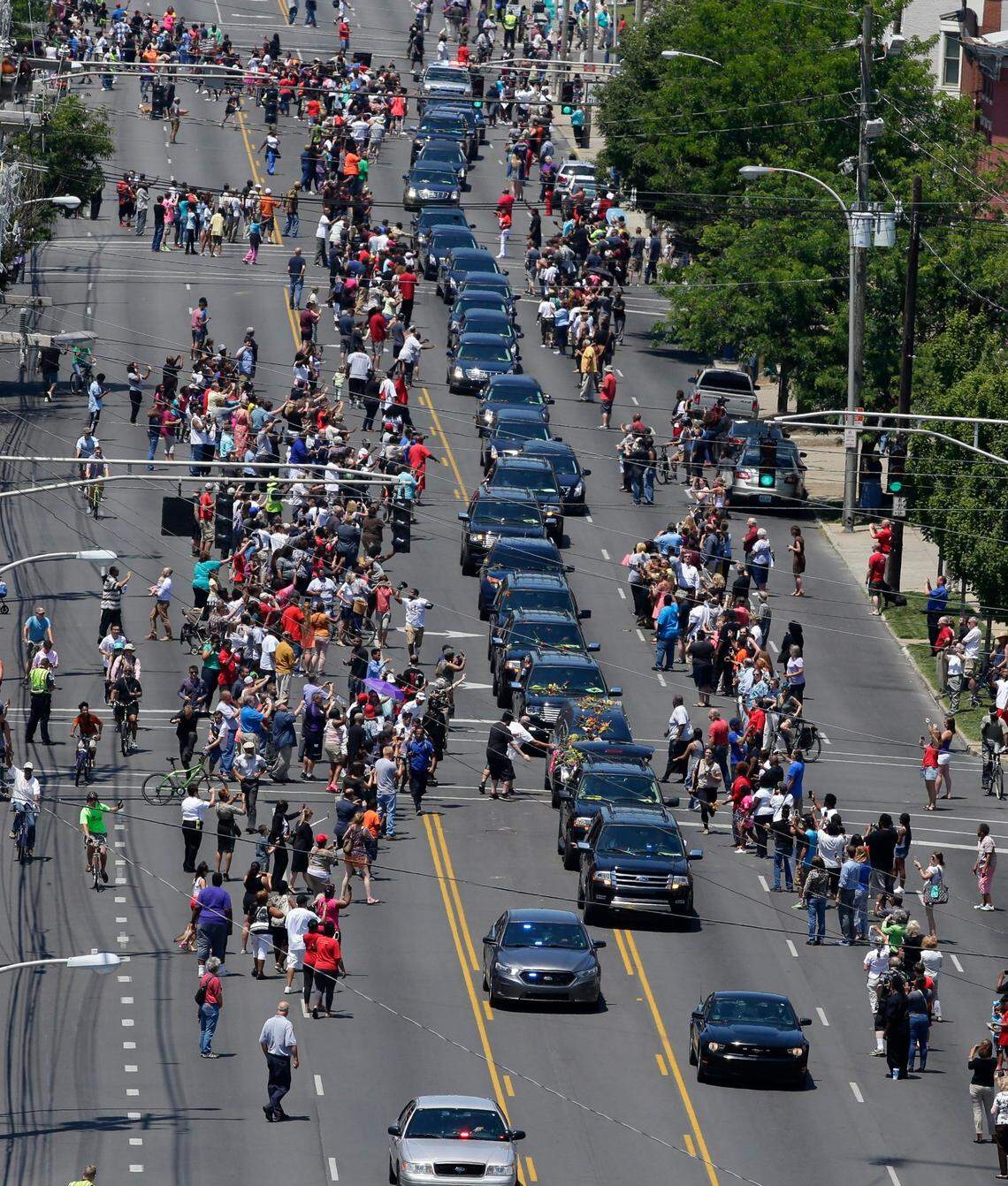 The Muhammad Ali funeral procession approached the Cave Hill Cemetery on Friday June 10, 2016 in Louisville, Ky. Ali was the three-time world heavy weight champion who died June 3, 2016.