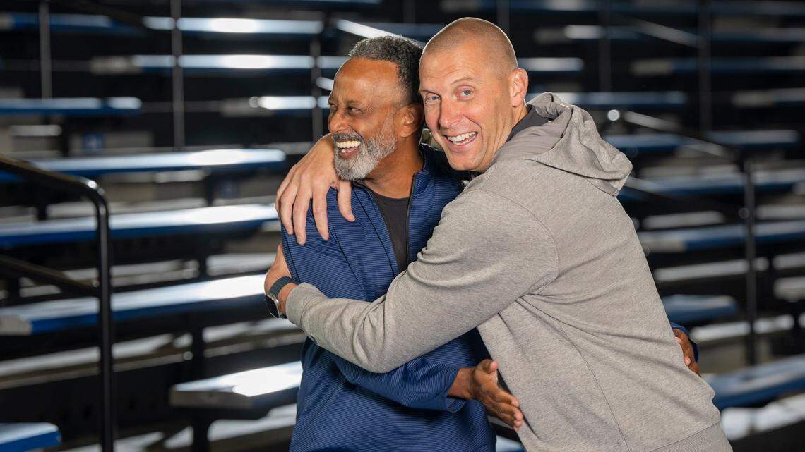 Kenny Brooks and Mark Pope play to the cameras during a preseason photo shoot in Memorial Coliseum. The two new UK head coaches will play their season openers on the same night on Nov. 4.