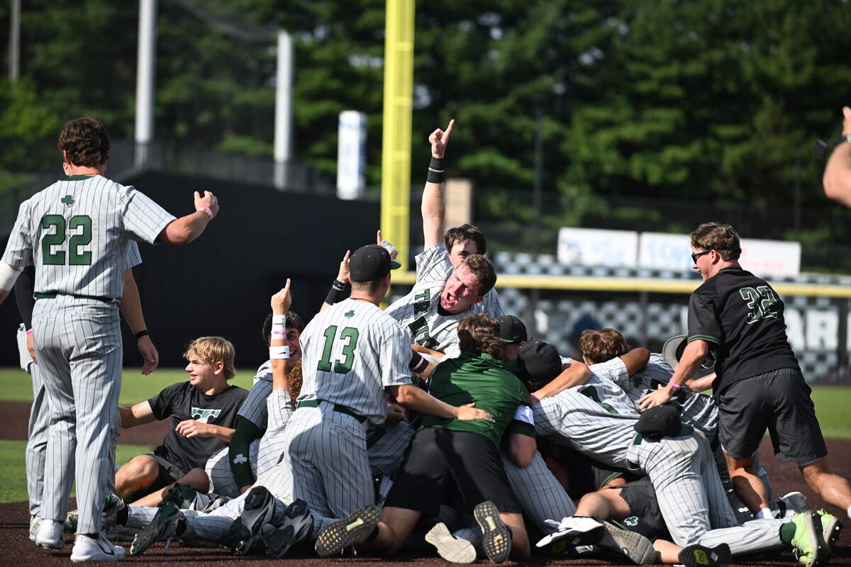 The Trinity Shamrocks pile into a celebration on the mound after completing their second straight Baseball State Tournament championship with a 12-0 win over Boyd County in five innings at Kentucky Proud Park on Saturday. Photos available for purchase via Danny Vaughn Photography.