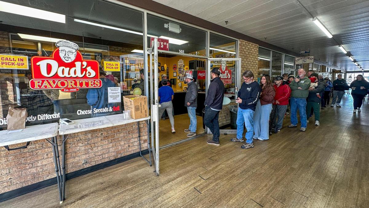 A line forms out the door into the Arcade Shops of the Garden Springs Shopping Center, Friday, Feb. 14, 2025 at Dad’s Favorites Deli in Lexington, Ky. The popular sandwich shop frequently has a line on Thursdays and Fridays for one its most popular daily sandwich specials, The Rushmore. Come early, they open at 11 a.m. and will run out.