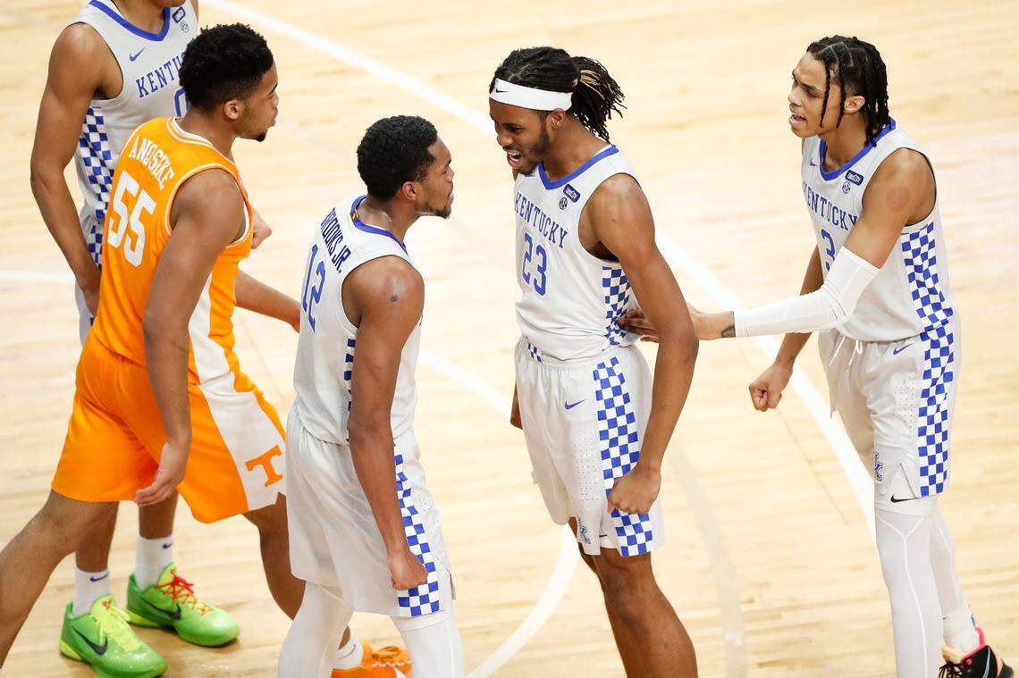 Kentucky’s Keion Brooks (12), Isaiah Jackson (23) and Brandon Boston (3) celebrated during Saturday’s game against Tennessee in Rupp Arena. The Wildcats again had a lead against a highly rated team but let it slip away in the game’s closing minutes.