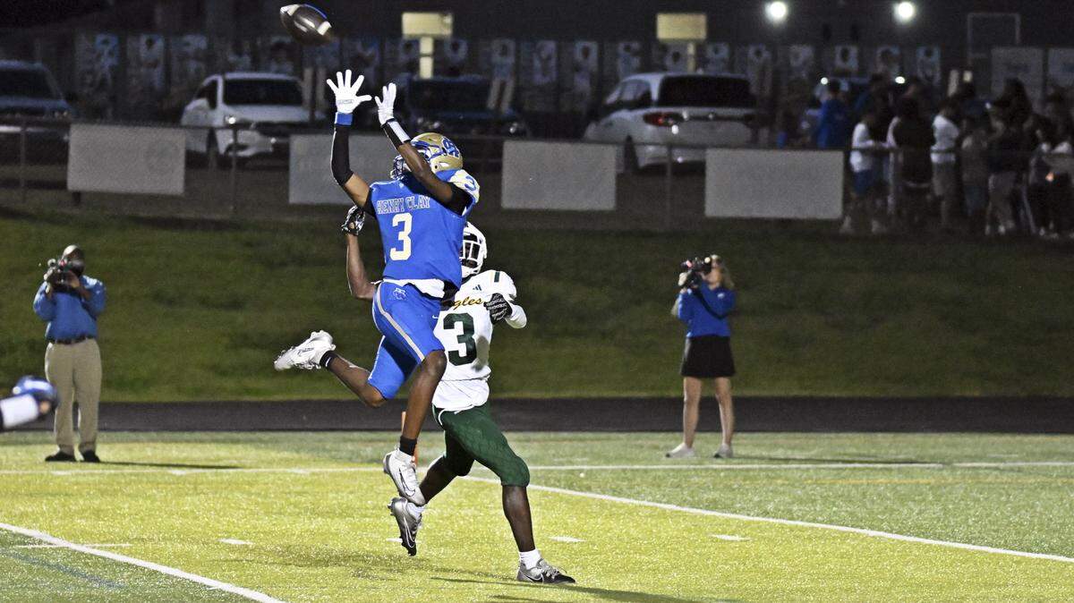 Henry Clay’s Chaii Paris hauls in a pass over North Bullitt defender Kevin Doe during the Blue Devils’ 46-8 home win over North Bullitt at Dr. Robert Jake Bell Stadium on Friday.